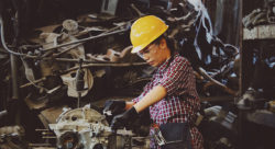 Stock image of a woman working machinery Chevanon Photography