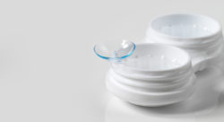 Stock photo of a contact sitting on a contact lens case