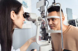 Stock photo of a young man having an comprehensive eye exam